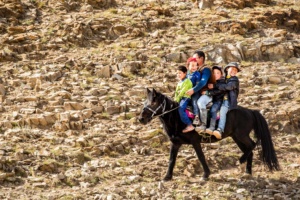 Local Kazakh children on a horse in western Mongolia