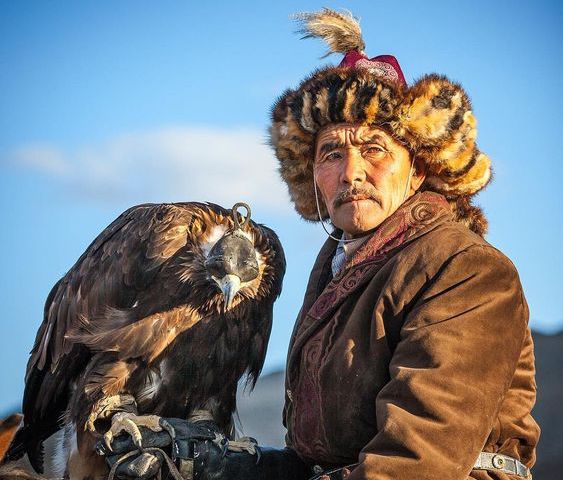 Falconry hood for male golden eagle of Kazakh hunters with an eagle 